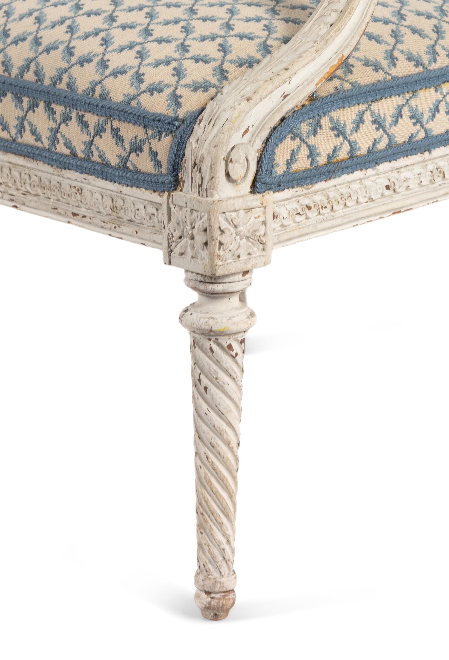 A Pair of Louis XVI Provincial White-Painted Fauteuils