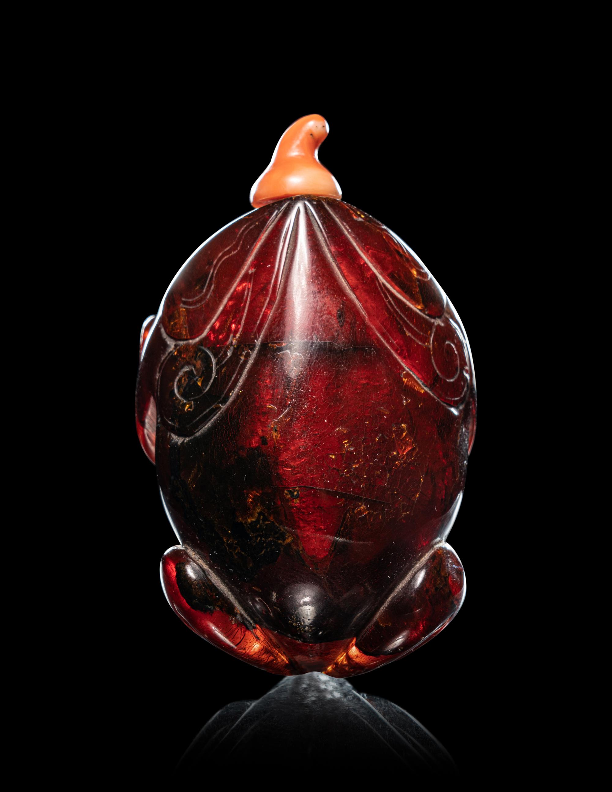Two Carved Amber Snuff Bottles