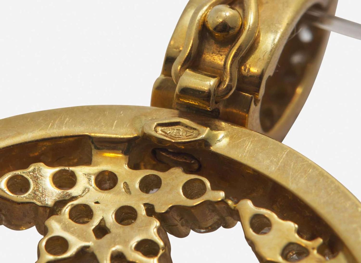 An 18K Yellow Gold and Diamond Pendant on a Lalique Cord