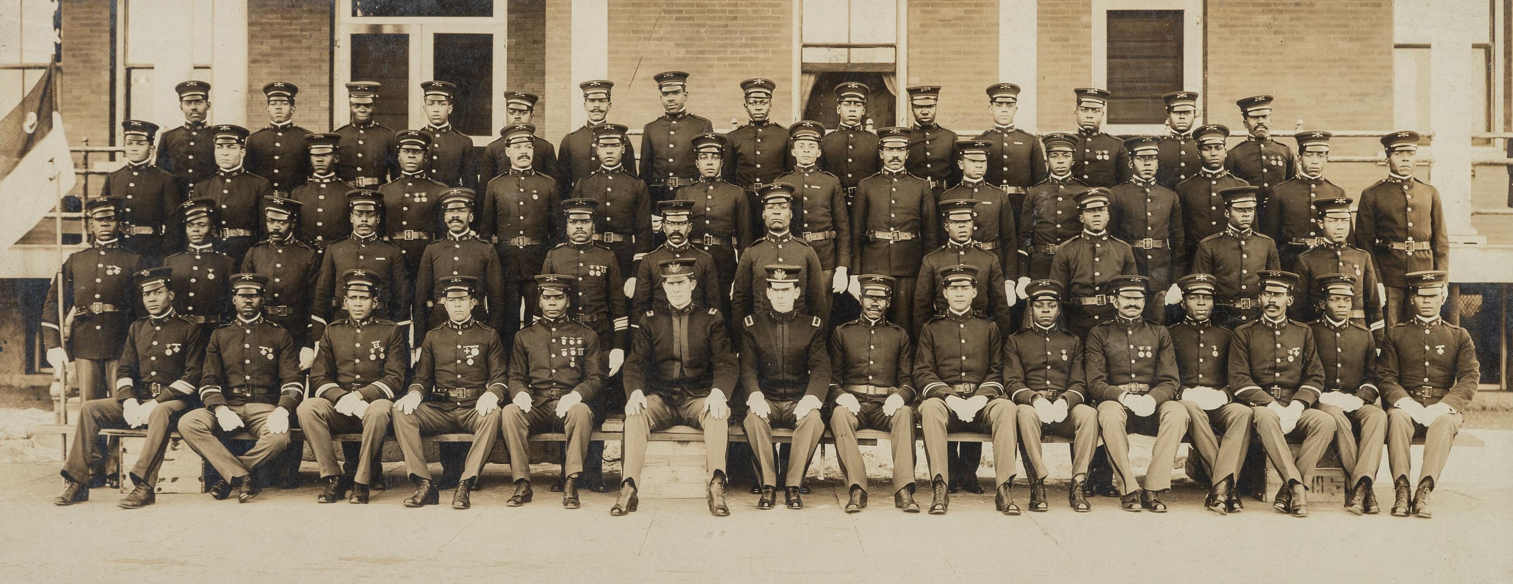 [BUFFALO SOLDIERS]. A group of 2 photographs of members of the 9th Cavalry, incl. Charles Young and George Prioleau. Fort D.A. Russell, Cheyenne, Wyoming, ca 1910s.