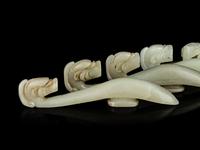 Four Chinese Celadon Jade 'Chilong' Belt Hooks