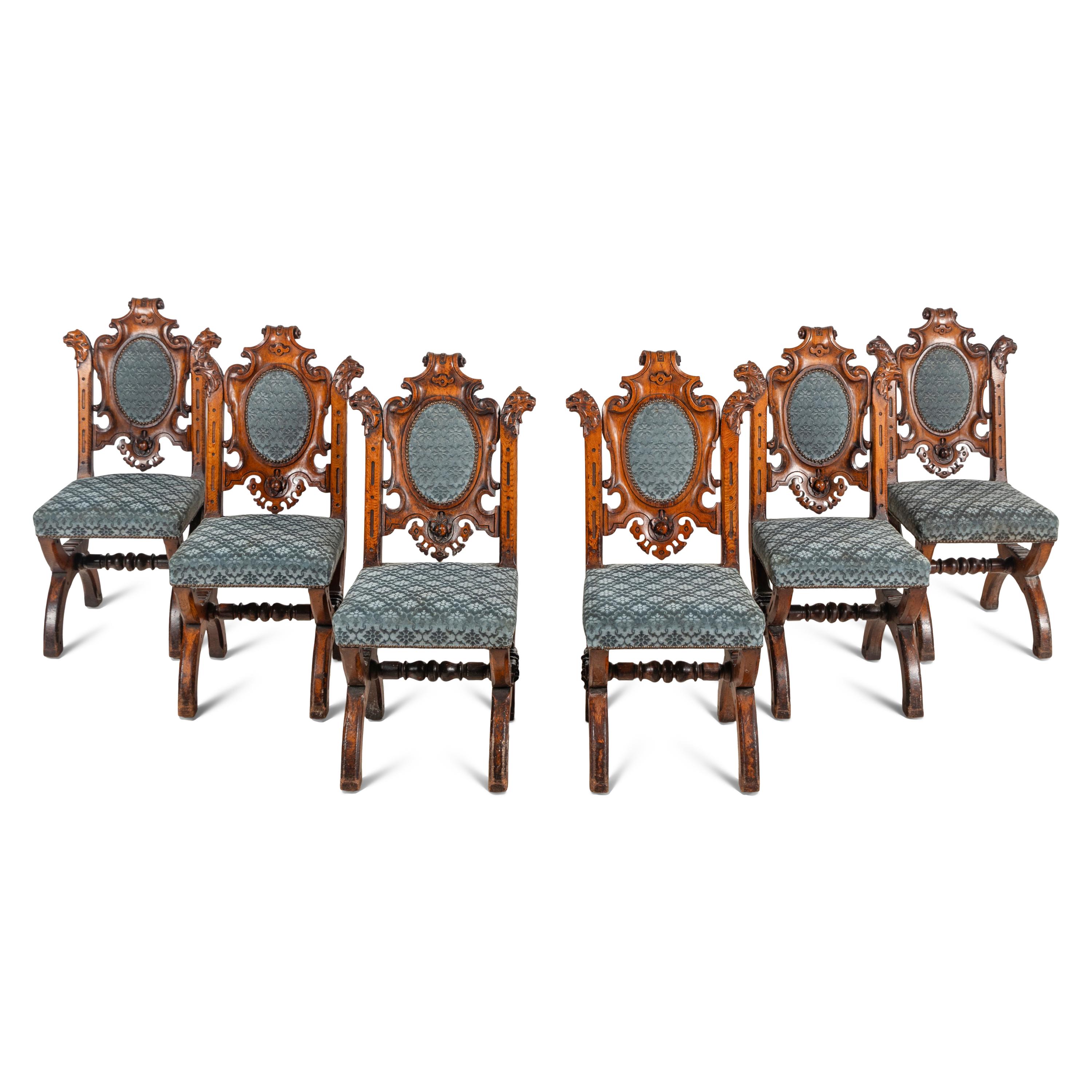 A Set of Six French Carved Oak Dining Chairs