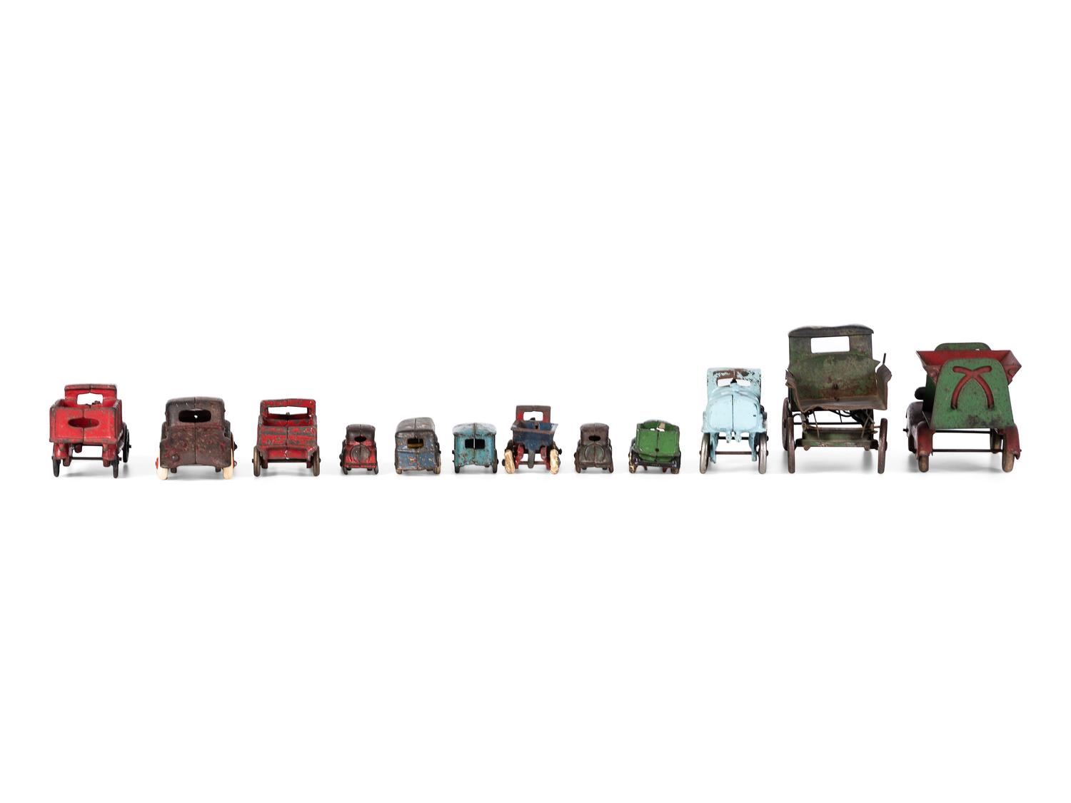 Twelve Painted Cast Iron Cars, Buses, and Trucks