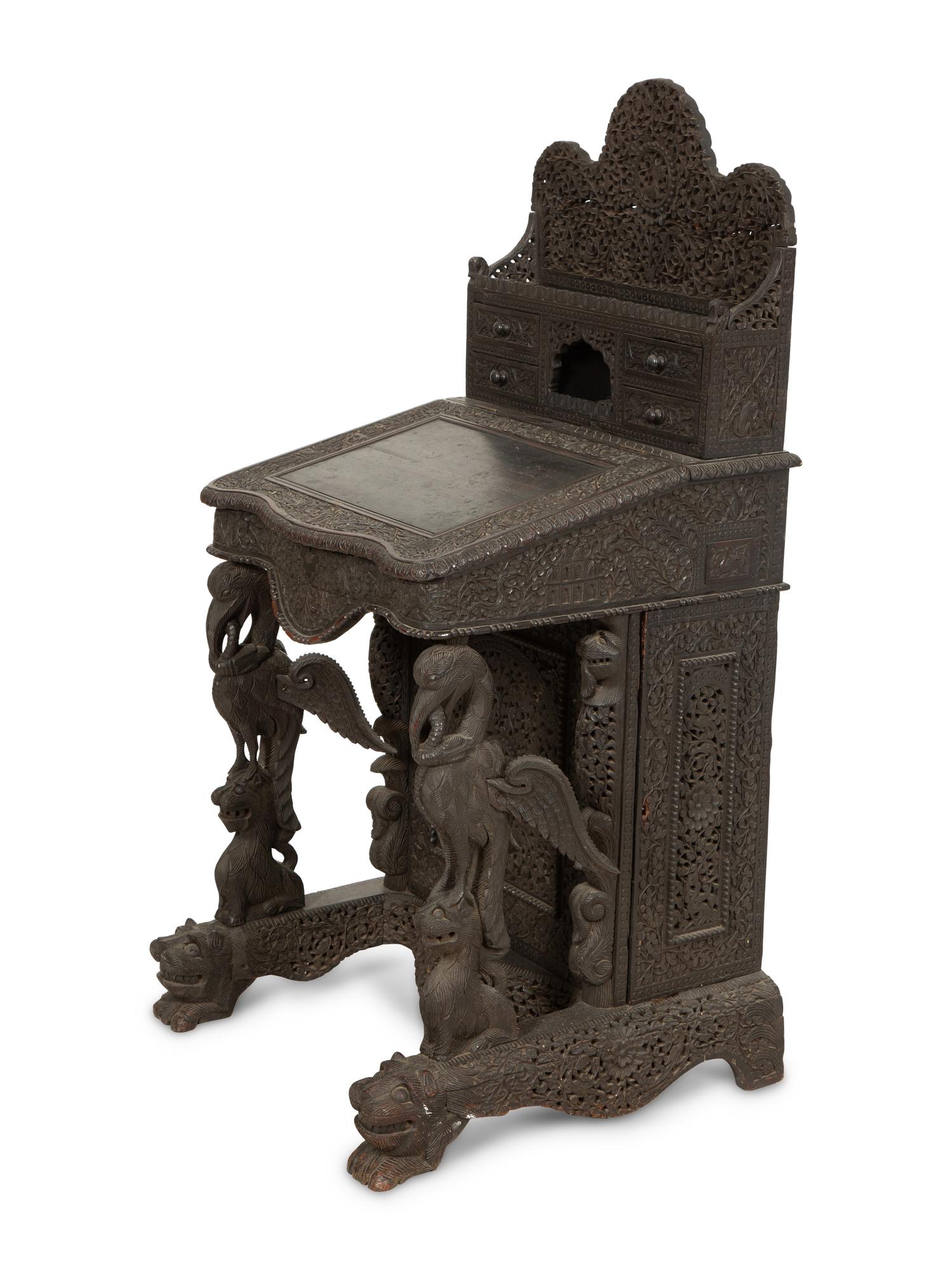 An Anglo-Burmese Carved Teak Davenport Desk