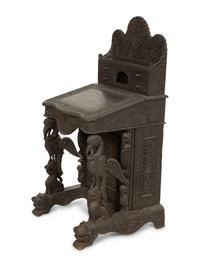 An Anglo-Burmese Carved Teak Davenport Desk