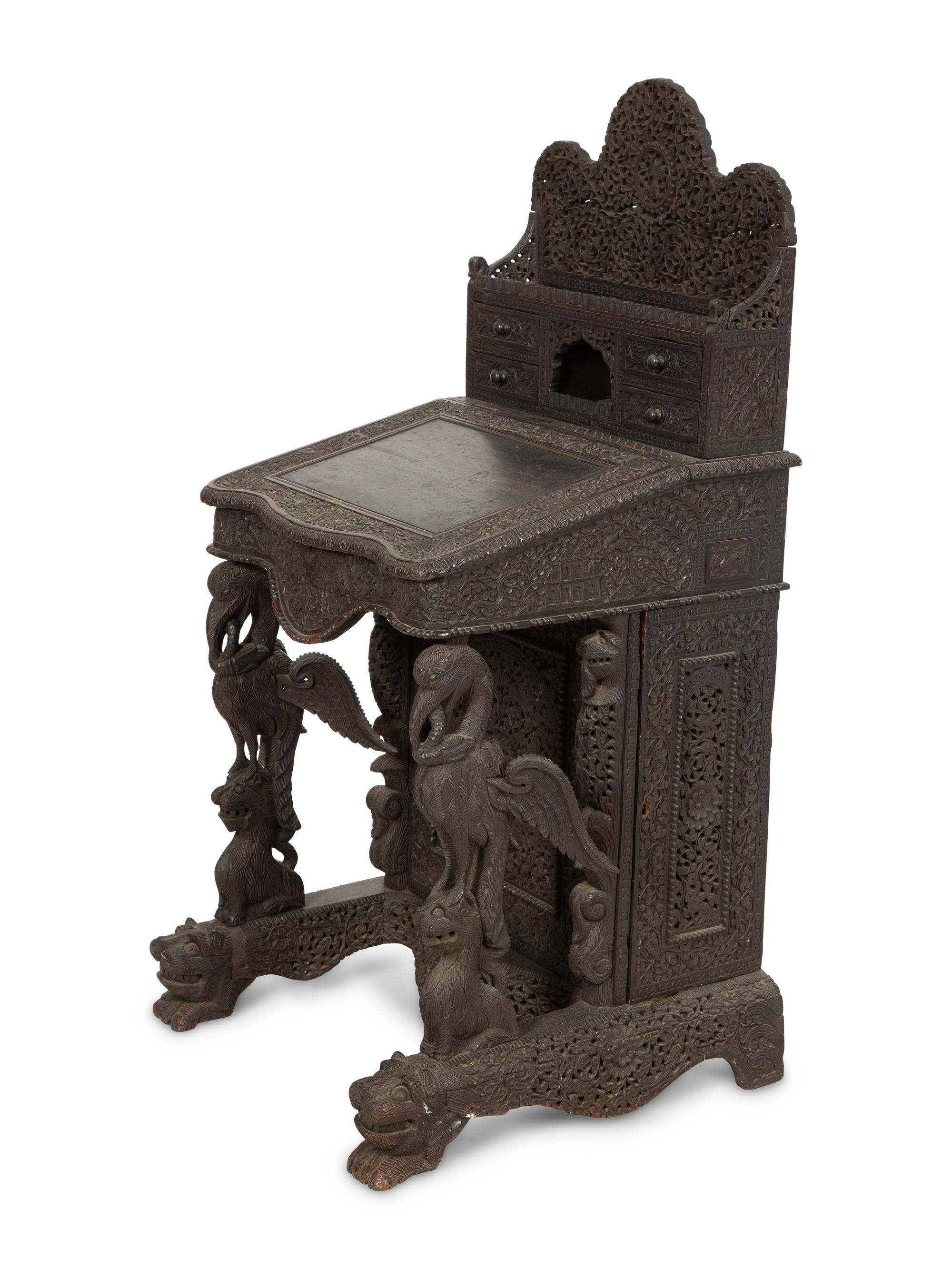 An Anglo-Burmese Carved Teak Davenport Desk