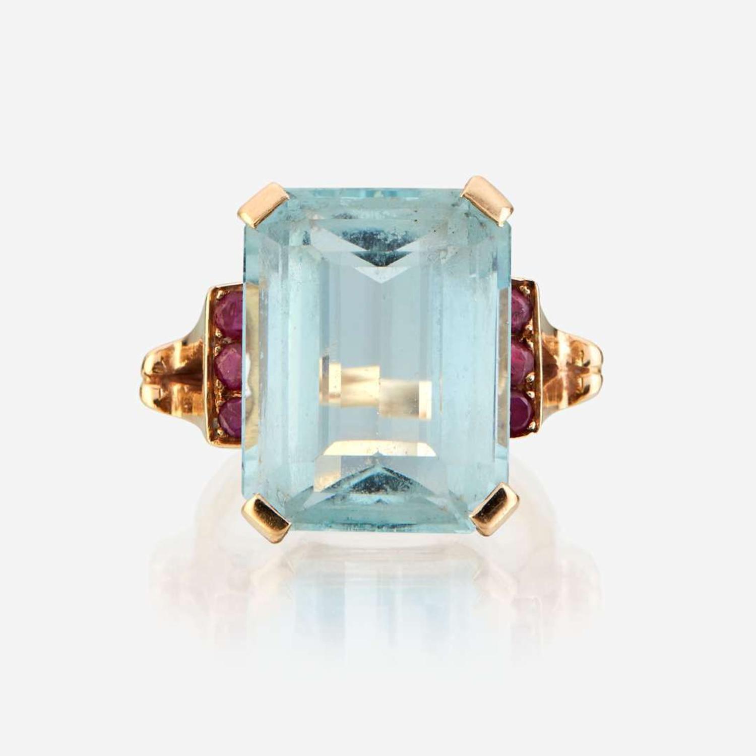 An aquamarine, ruby, and gold ring