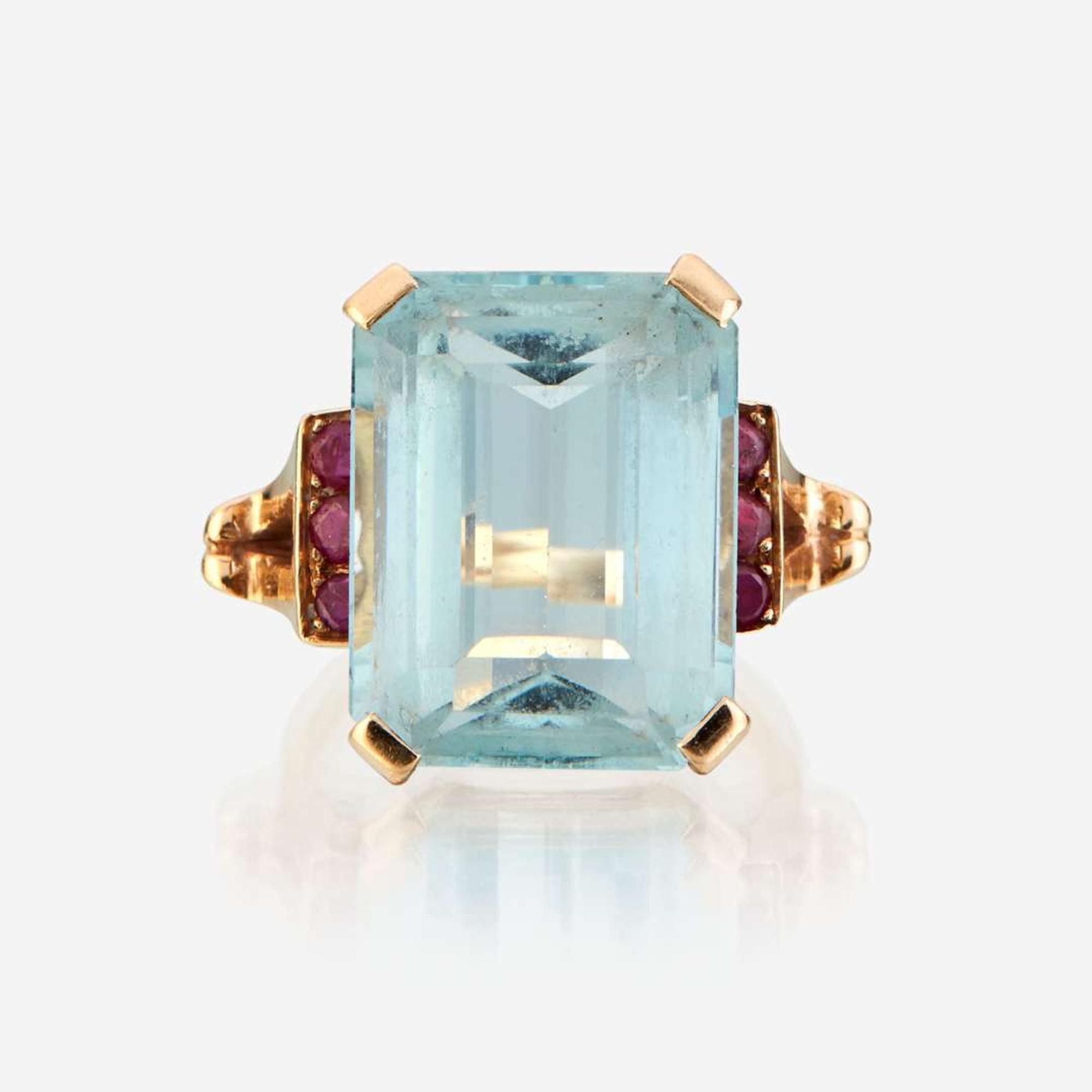 An aquamarine, ruby, and gold ring