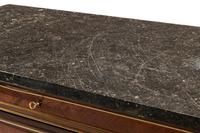 A Louis XVI Style Gilt Bronze Mounted Mahogany Marble-Top Commode
