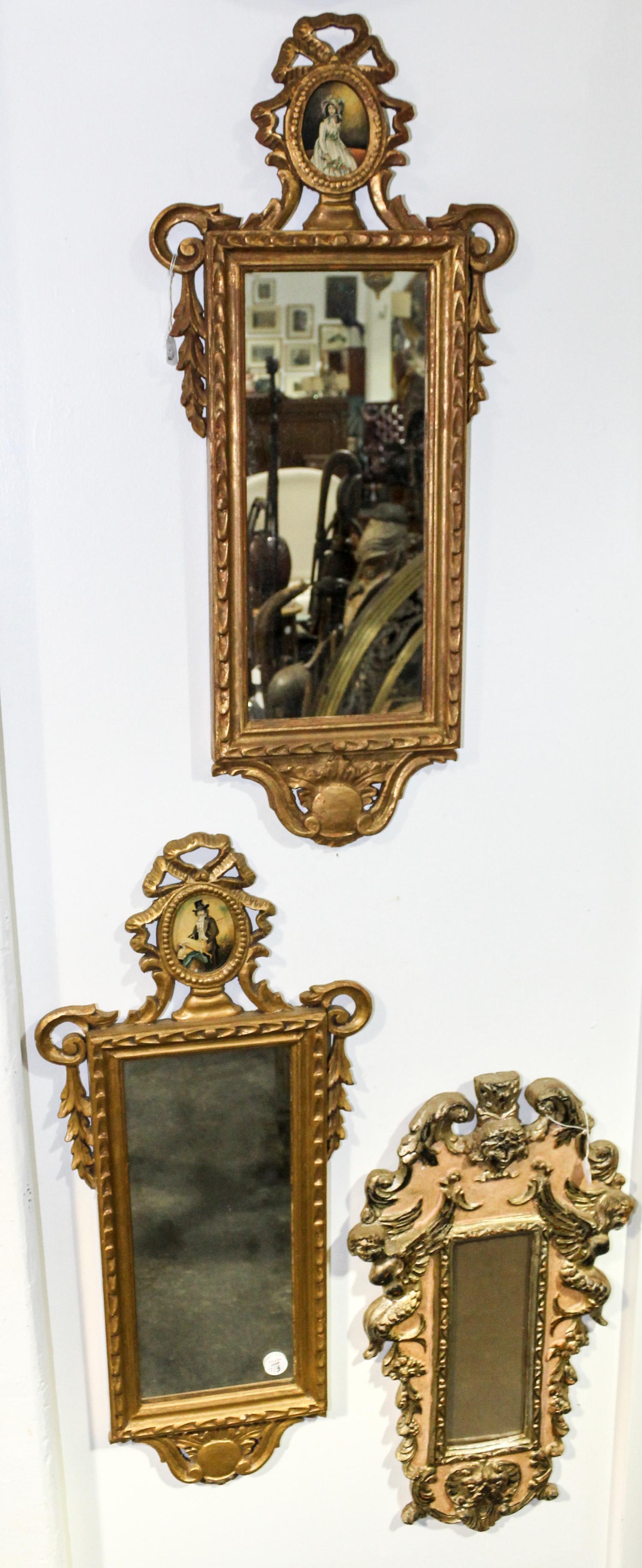 A Pair of Italian Carved and Silvered Mirrors Height of pair 24 x width 13 inches.