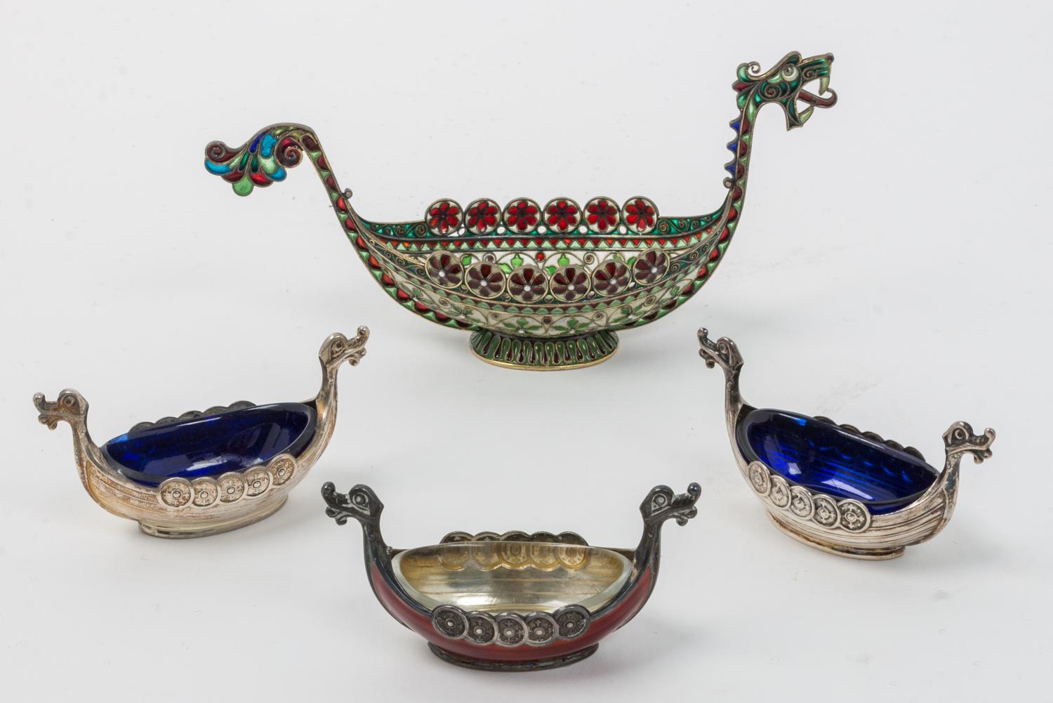 A Group of Four Swedish Silver Salts, 20th Century, each in the form of a Viking ship, comprising a champleve enamel example, one ename