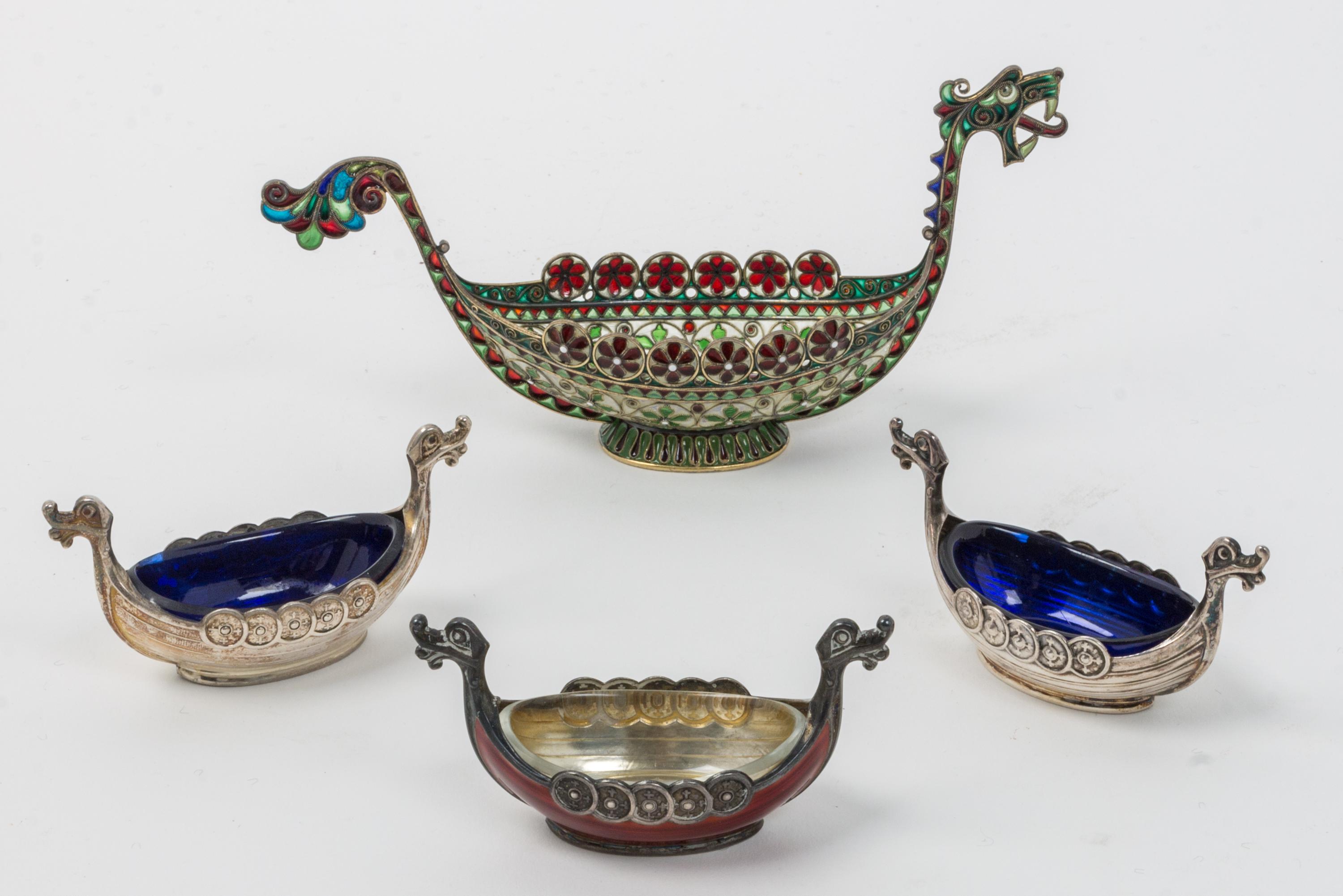 A Group of Four Swedish Silver Salts, 20th Century, each in the form of a Viking ship, comprising a champleve enamel example, one ename