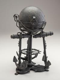 A Nautical Carved Wood and Iron Cannon Ball Stand