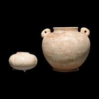 A Chinese Small Melon Form Coupe and a Small Jar, Tang Dynasty or Later 唐或以後 白釉瓜棱水呈及白陶雙系罐