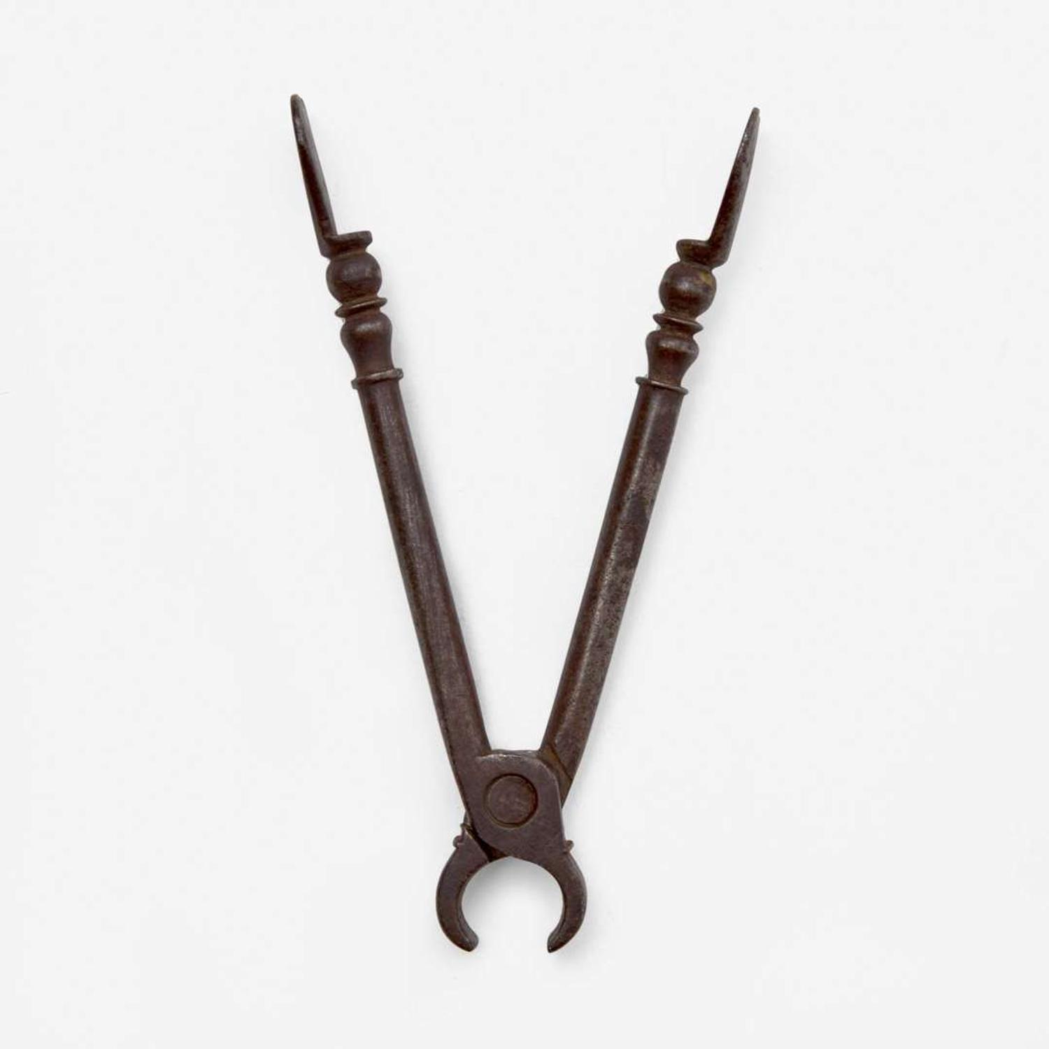 An unusual set of iron sugar nippers Dated "1785"