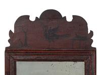 A William and Mary Black and Red Painted Bird and Vine-Decorated Courting Glass