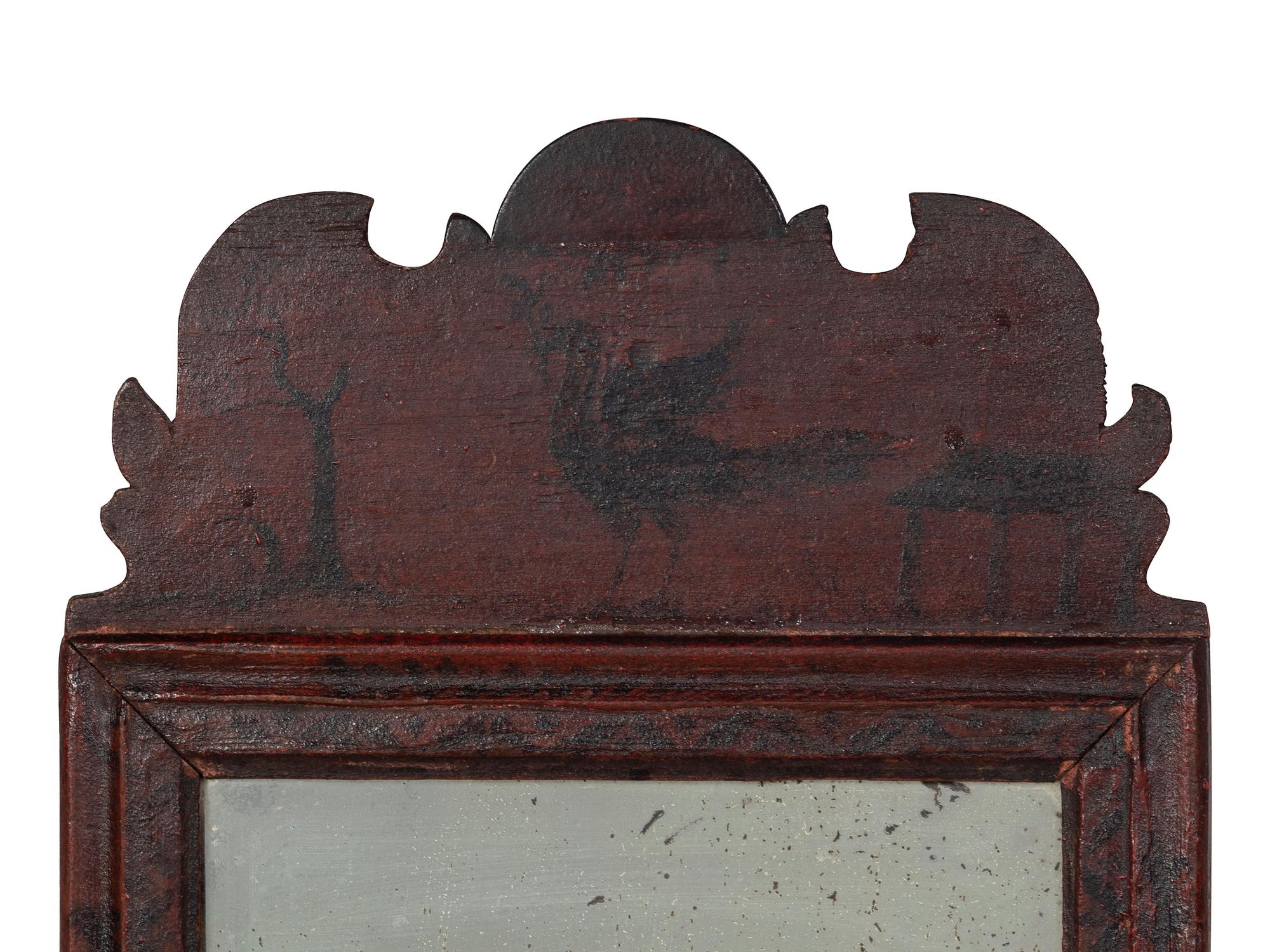 A William and Mary Black and Red Painted Bird and Vine-Decorated Courting Glass