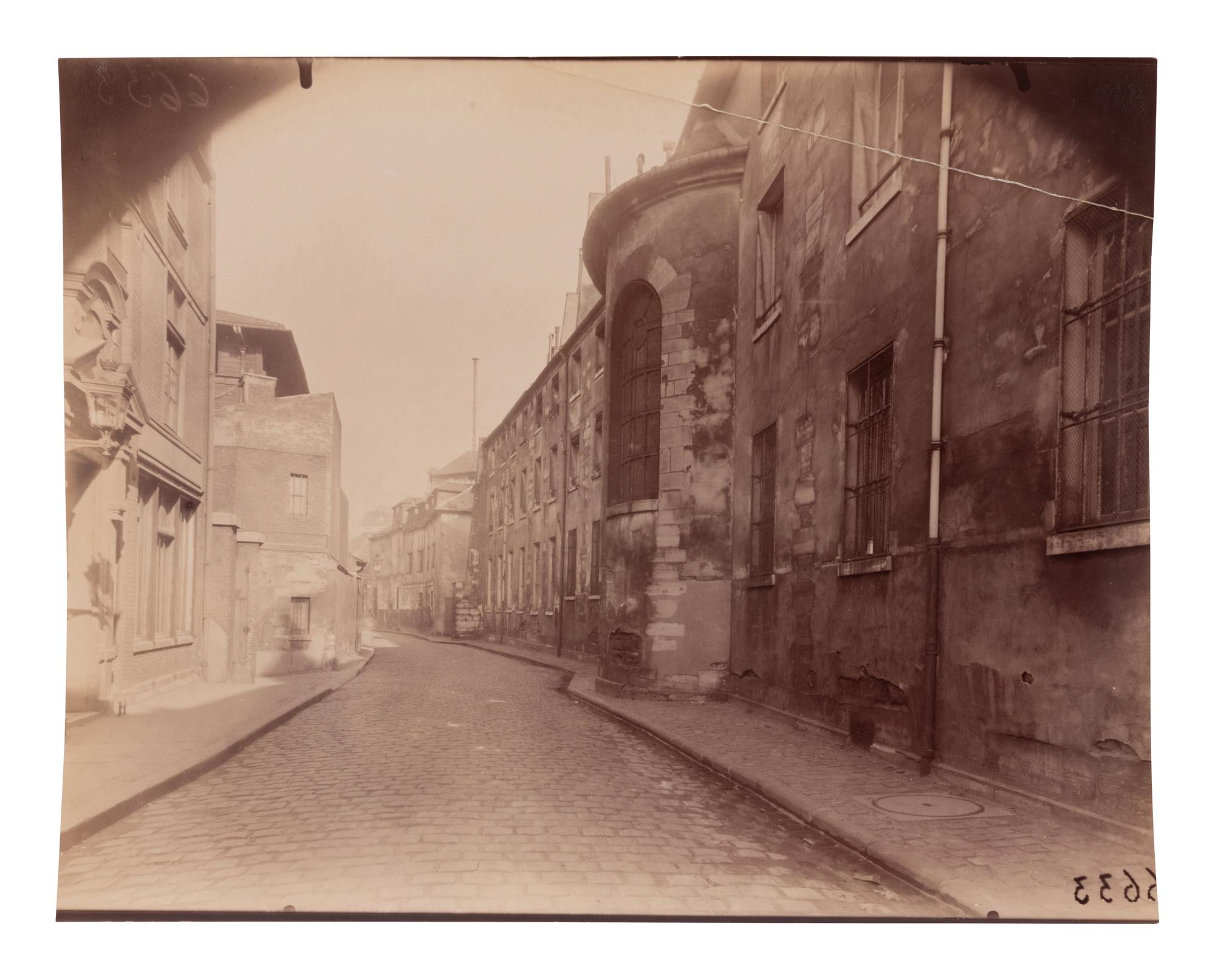 A group of four photographs depicting Paris ( Moulin Rouge [86 boulevard de Clichy] ; Passage Moret, ruelle des Gobelins ; Rue des Prêtres Saint-Séverin, au fond rue Boutebrie; Rue des Gobelins)