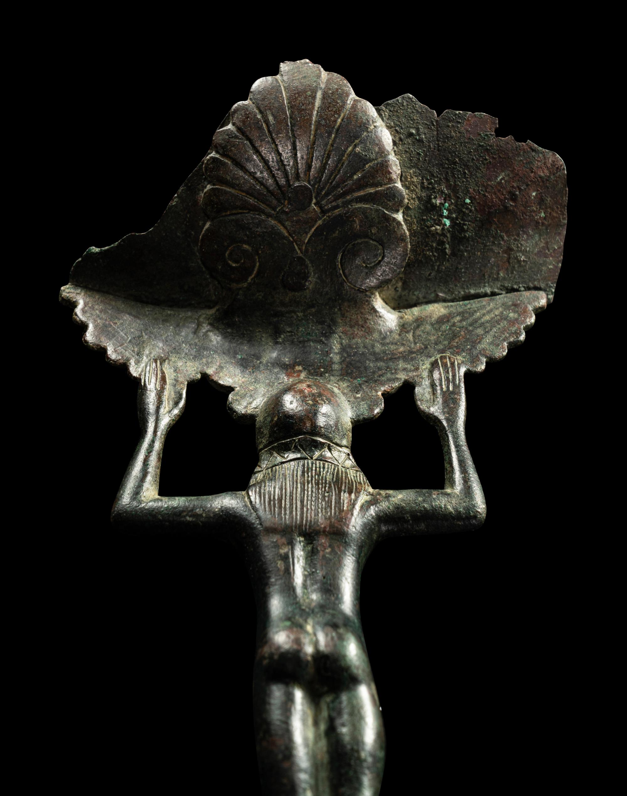 A Western Greek Bronze Patera with a Nude Youth as Handle
