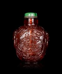 A Carved Amber Snuff Bottle