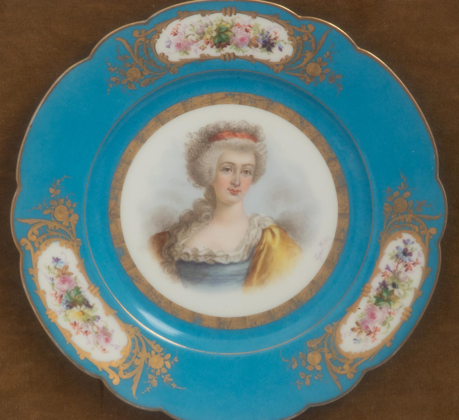A Group of Seven Framed Sèvres Style Porcelain Plates