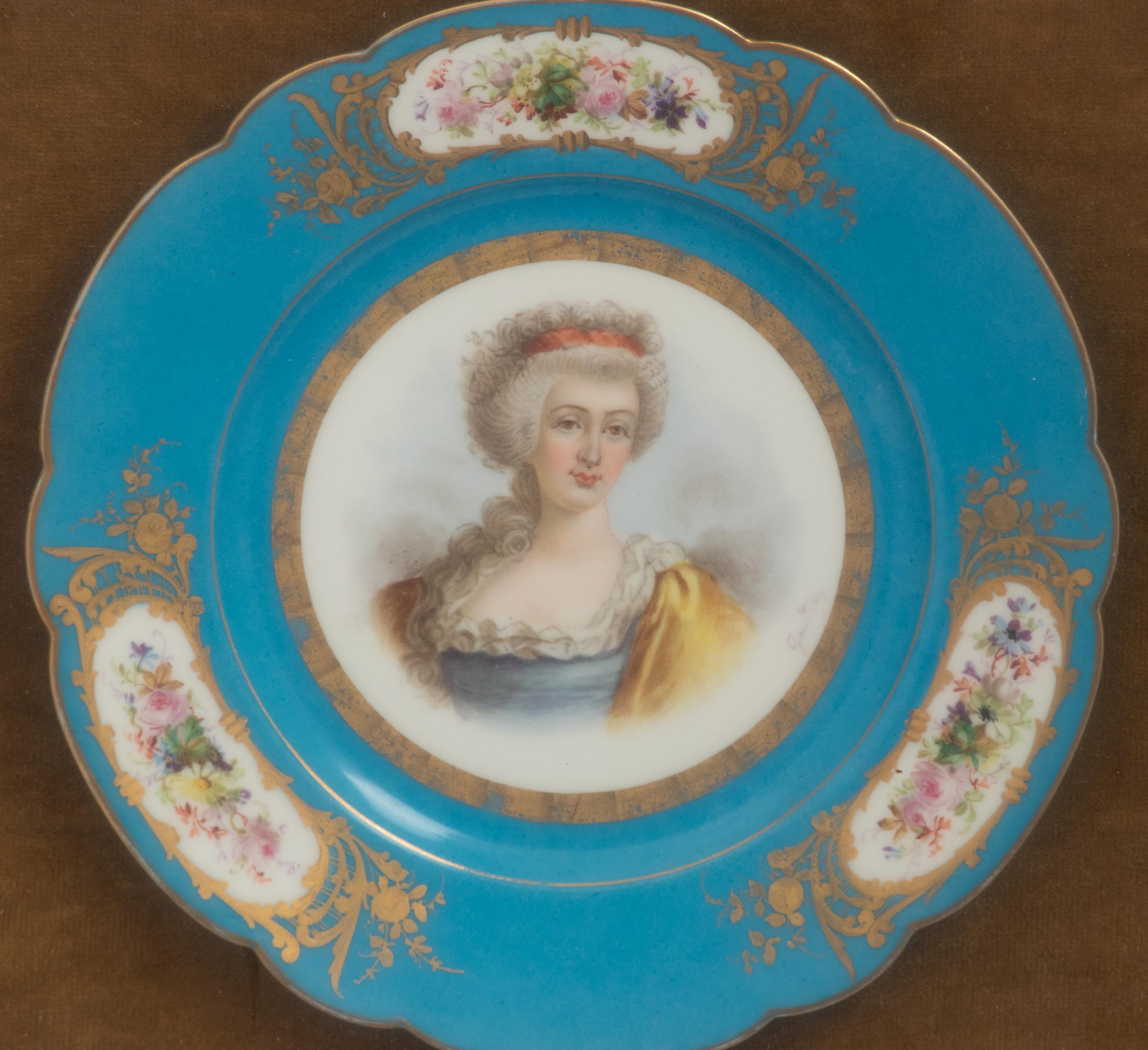 A Group of Seven Framed Sèvres Style Porcelain Plates