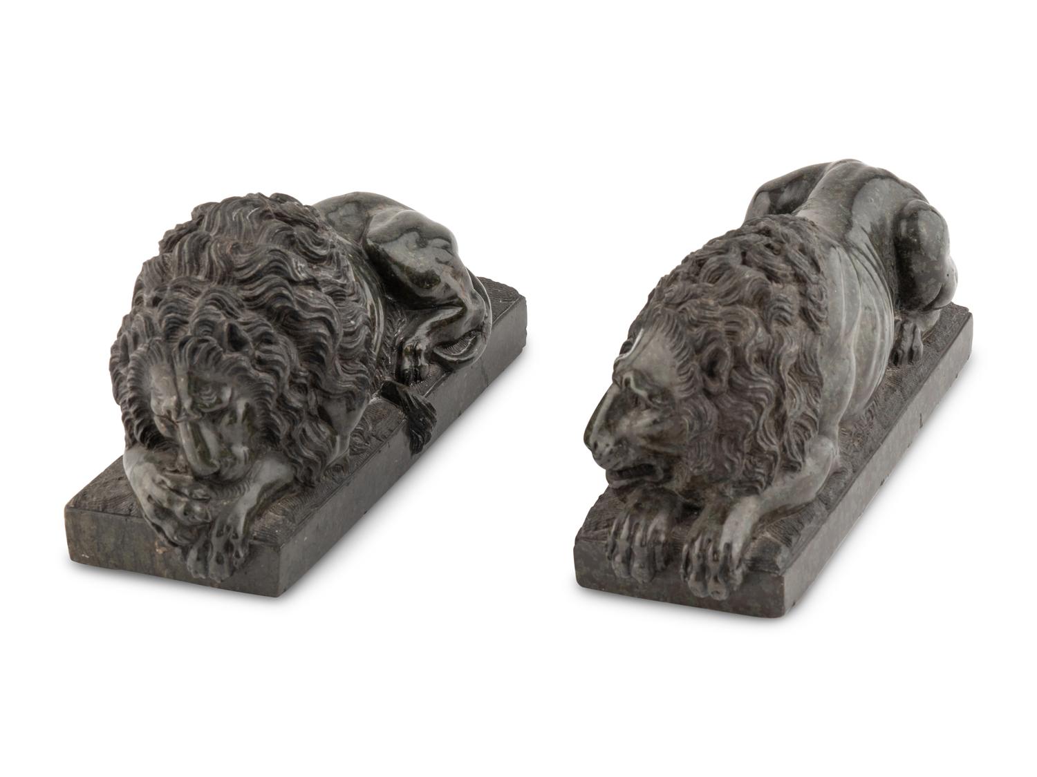 A Pair of Carved Green Marble Recumbent Lions