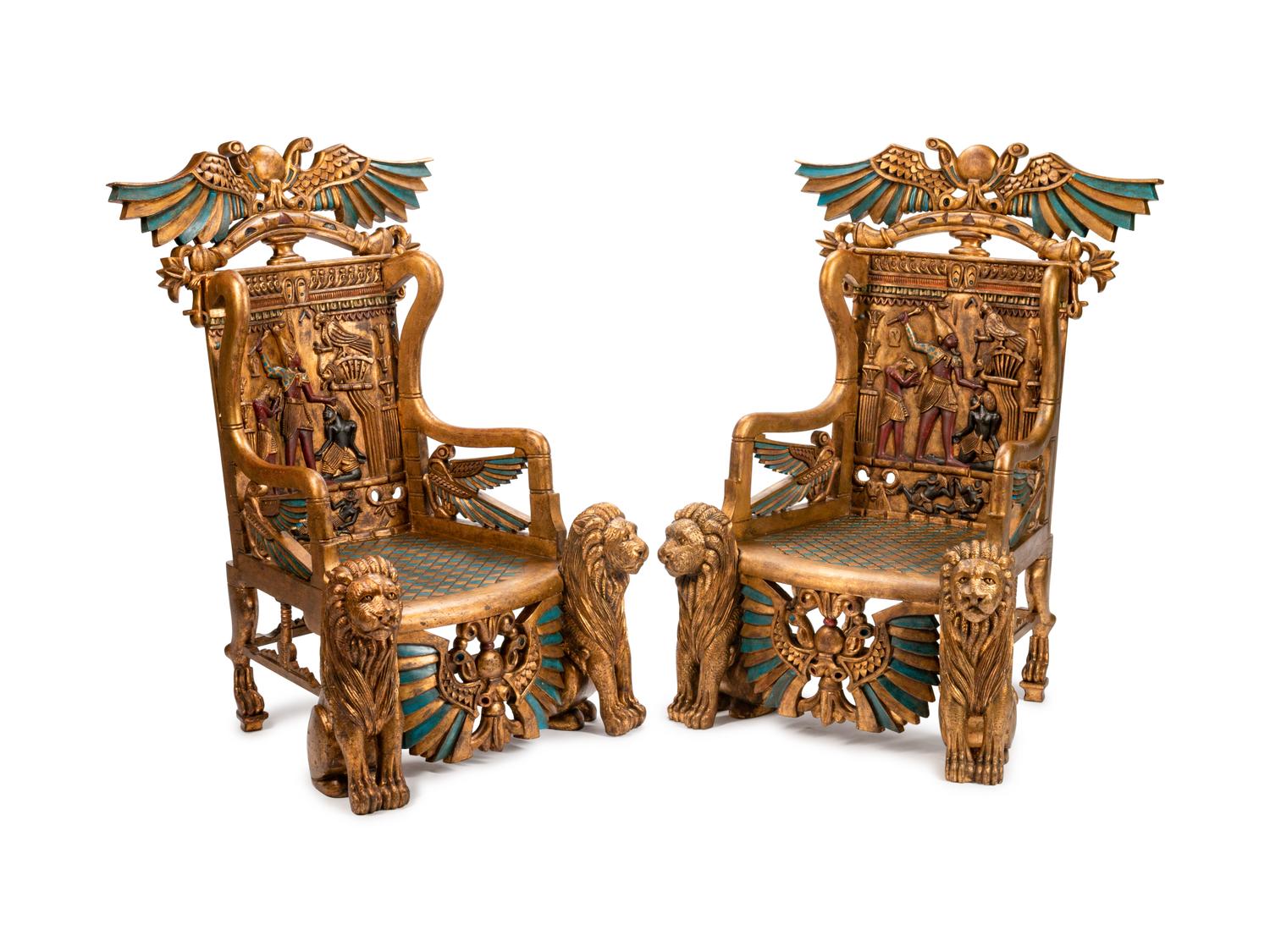 A Pair of Egyptian Revival Style Parcel-Gilt and Polychromed Throne Chairs