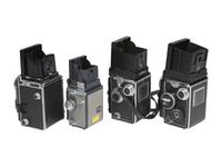 [CAMERAS]. 4 Twin Lens Reflex cameras with related material, incl. two Rolleiflex cameras.