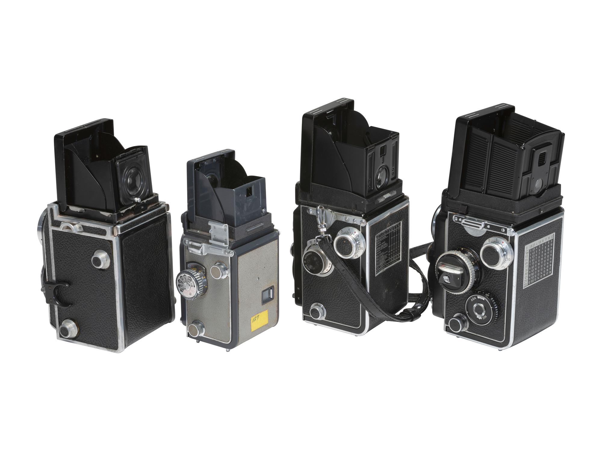 [CAMERAS]. 4 Twin Lens Reflex cameras with related material, incl. two Rolleiflex cameras.