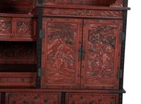 A Chinese Export Carved Red Lacquer Curio Cabinet — EARLY 20TH CENTURY