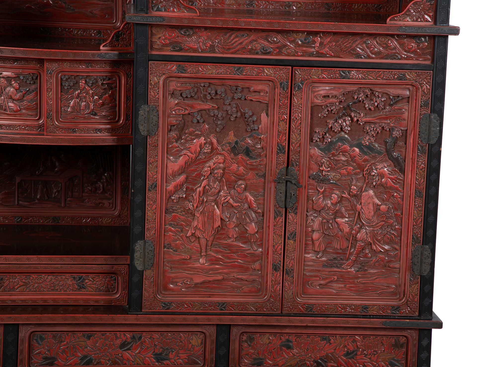 A Chinese Export Carved Red Lacquer Curio Cabinet — EARLY 20TH CENTURY