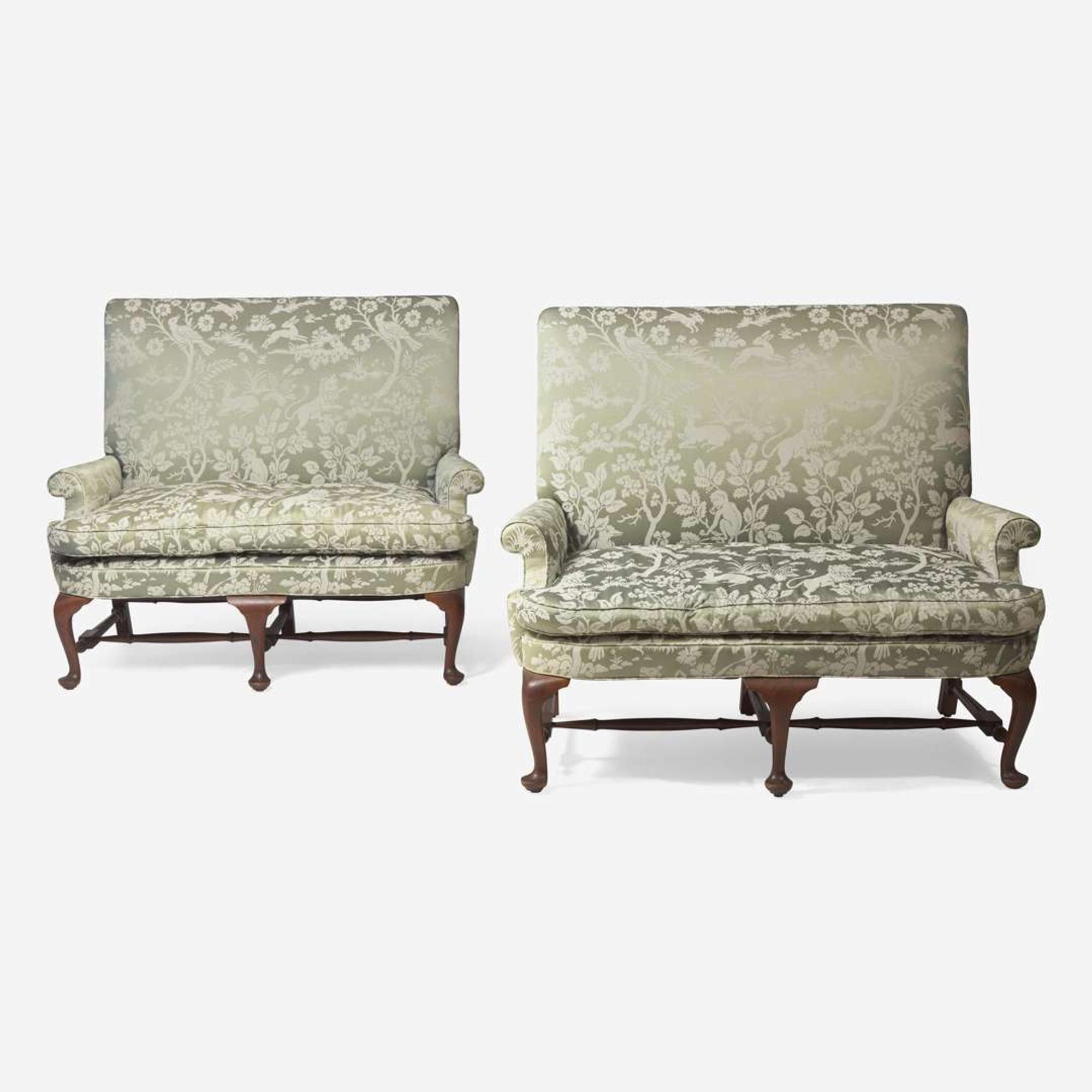 A pair of Queen Anne style walnut settees with silk damask upholstery late 19th / early 20th century
