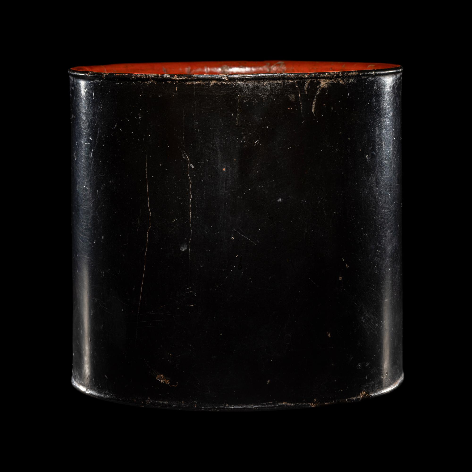 A Chinese Black and Red Lacquered Brushpot, Bitong, Wanli Mark 萬曆丙午（1606）款黑漆素面筆筒