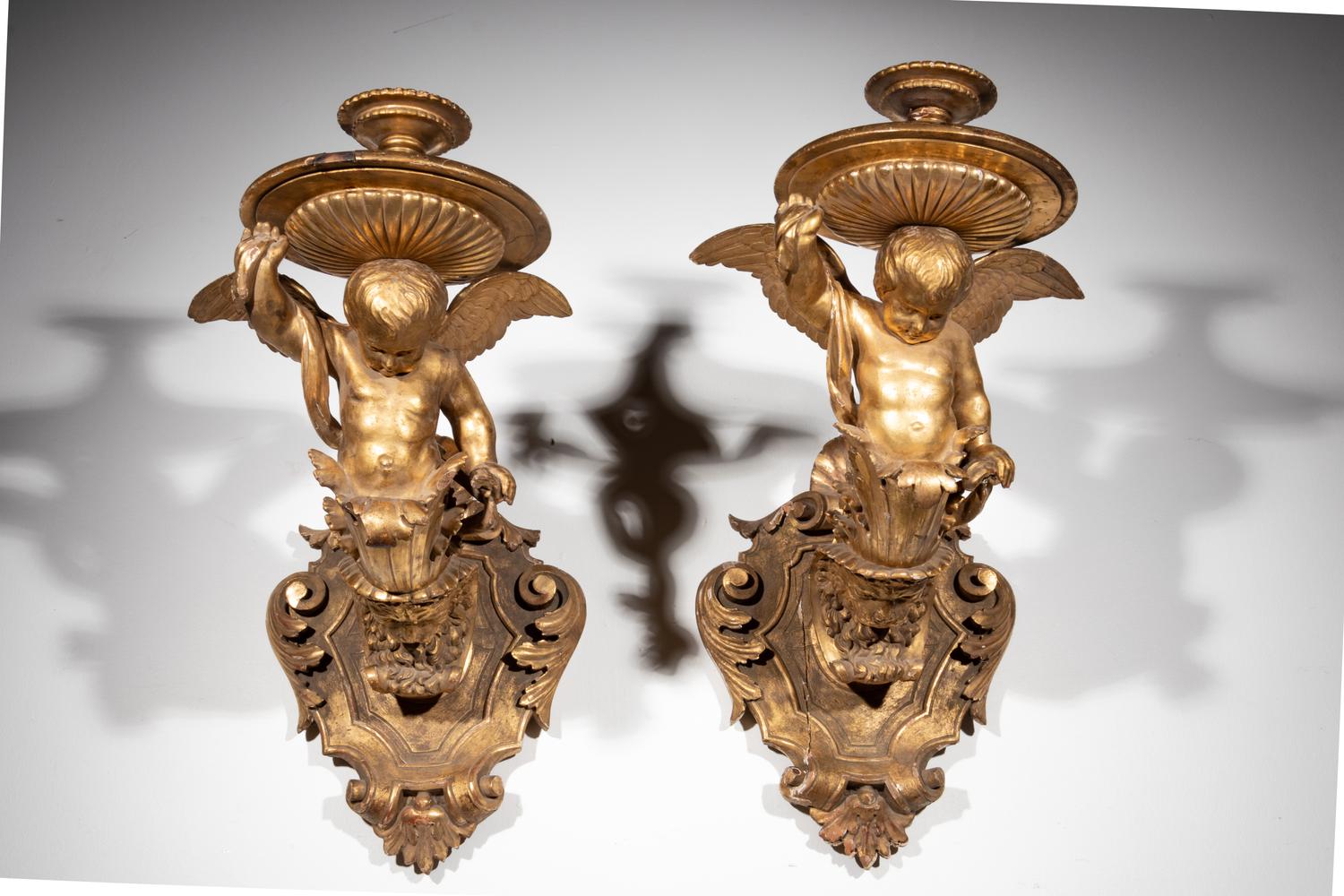 A Pair of Italian Giltwood Figural Wall Brackets