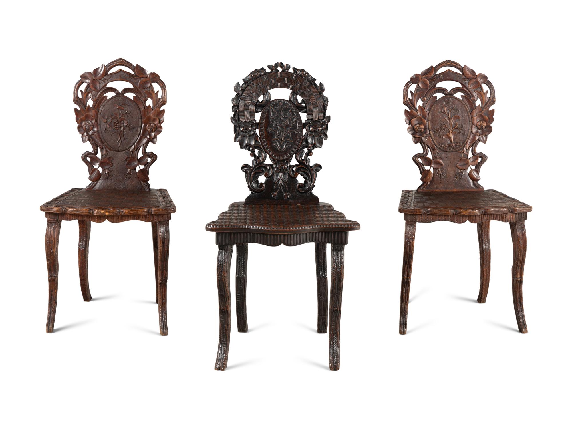 Three Black Forest Carved Side Chairs