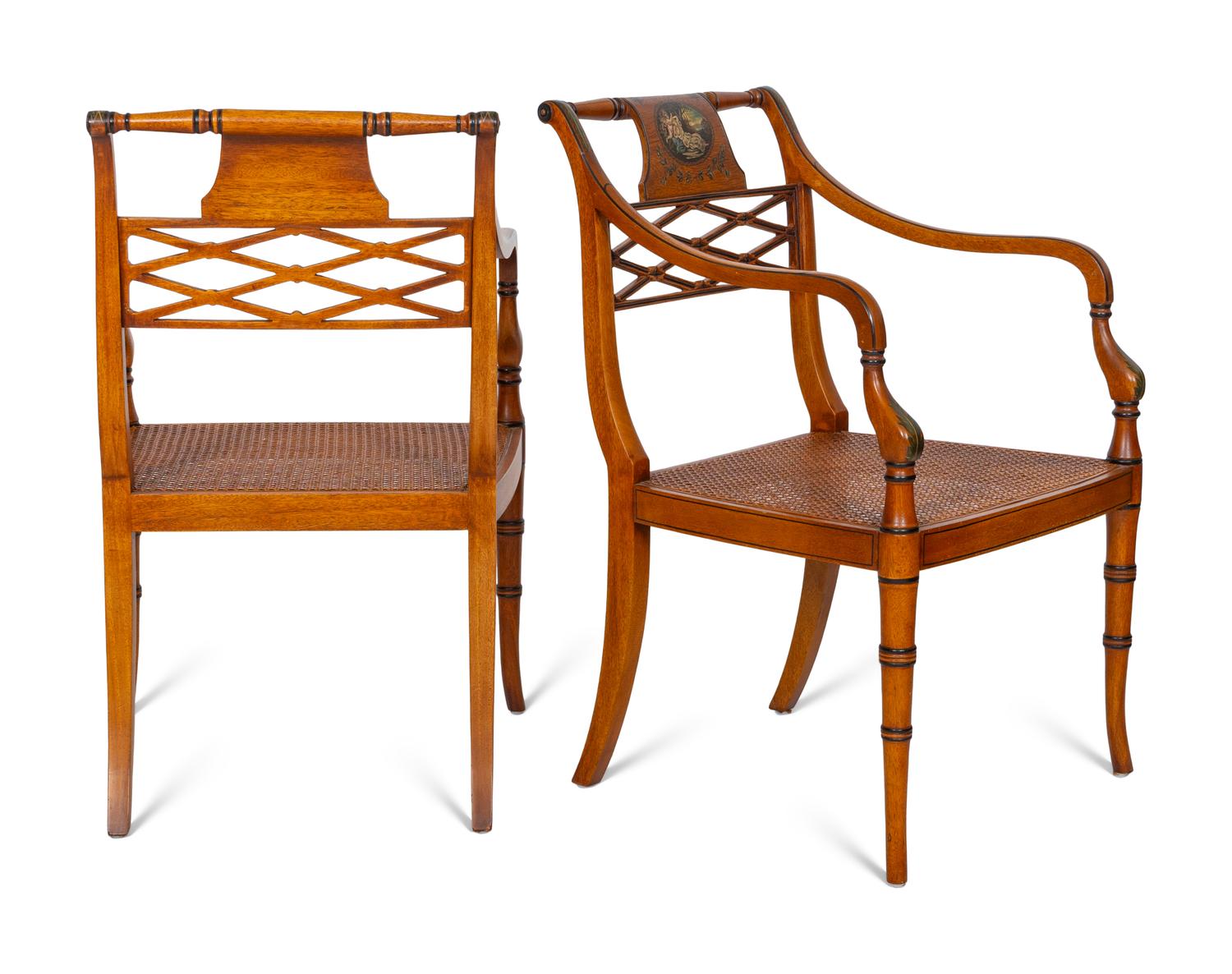 A Pair of Regency Style Paint Decorated and Parcel Ebonized Armchairs