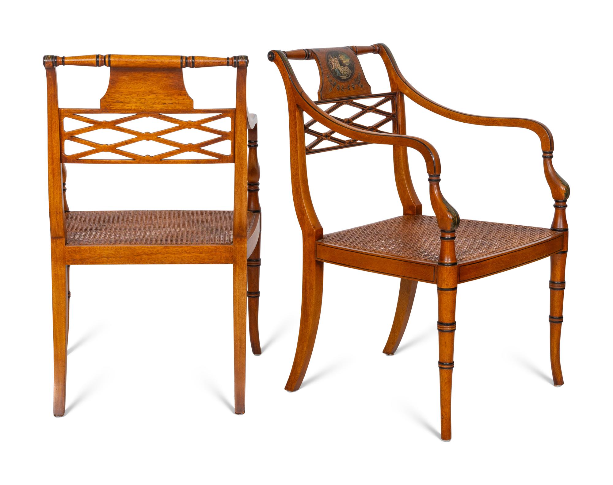 A Pair of Regency Style Paint Decorated and Parcel Ebonized Armchairs