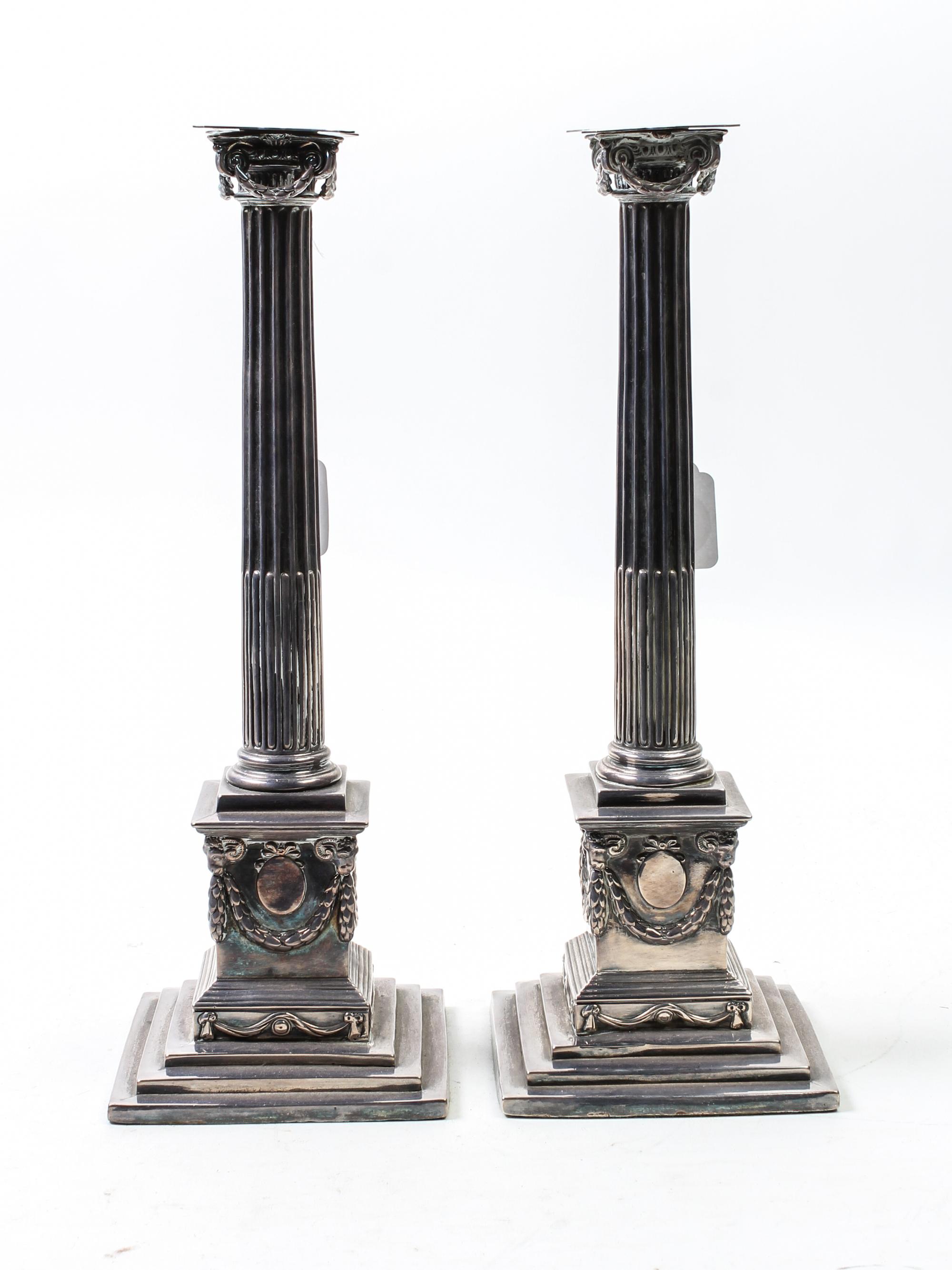 A Pair of English Silver-Plate Candle Holders Height 15 inches. — 19TH CENTURY