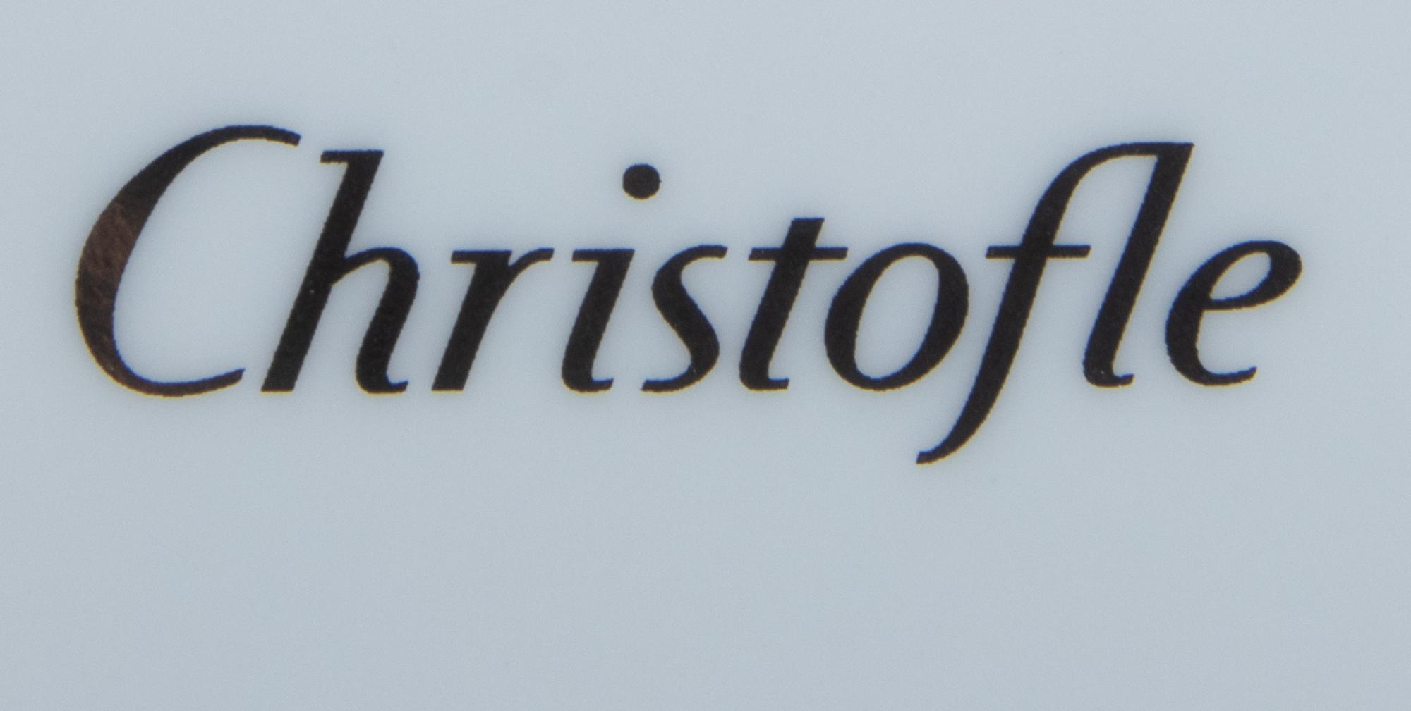 A Set of Twelve Christofle Porcelain Chargers