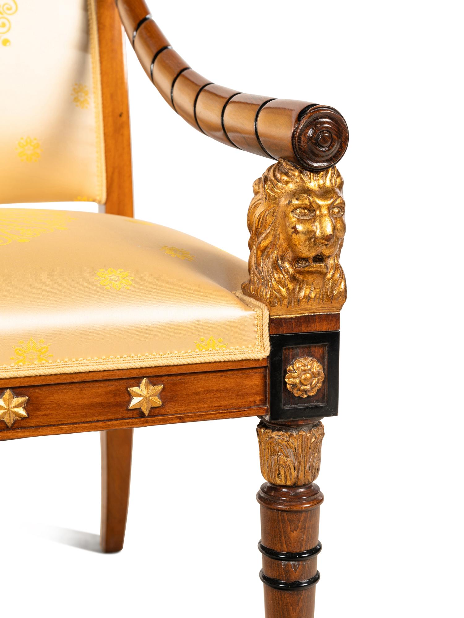 An Empire Style Parcel Gilt and Ebonized Armchair