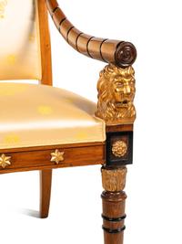 An Empire Style Parcel Gilt and Ebonized Armchair