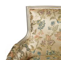 A Pair of Louis XVI Style Painted and Parcel Gilt Bergères