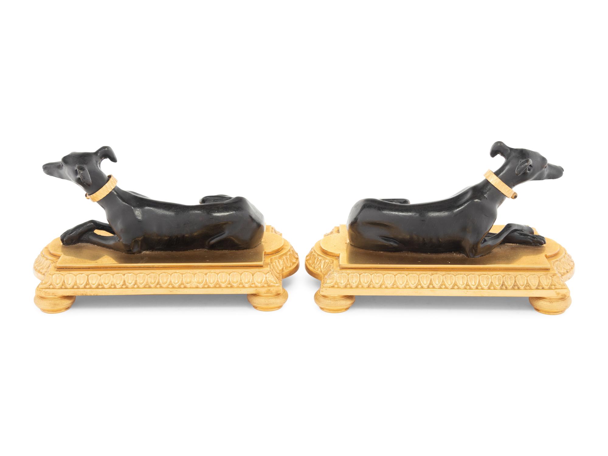 A Pair of French Gilt and Patinated Bronze Models of Greyhounds