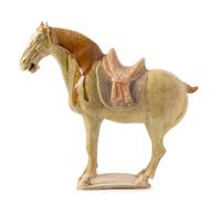 A Straw Glazed Pottery Figure of a Caparisoned Horse TANG DYNASTY Height 12 7/8 inches. — TANG DYNASTY