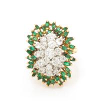 An 18 Karat Gold, Diamond and Emerald Cluster Ring, 7.50 dwts.