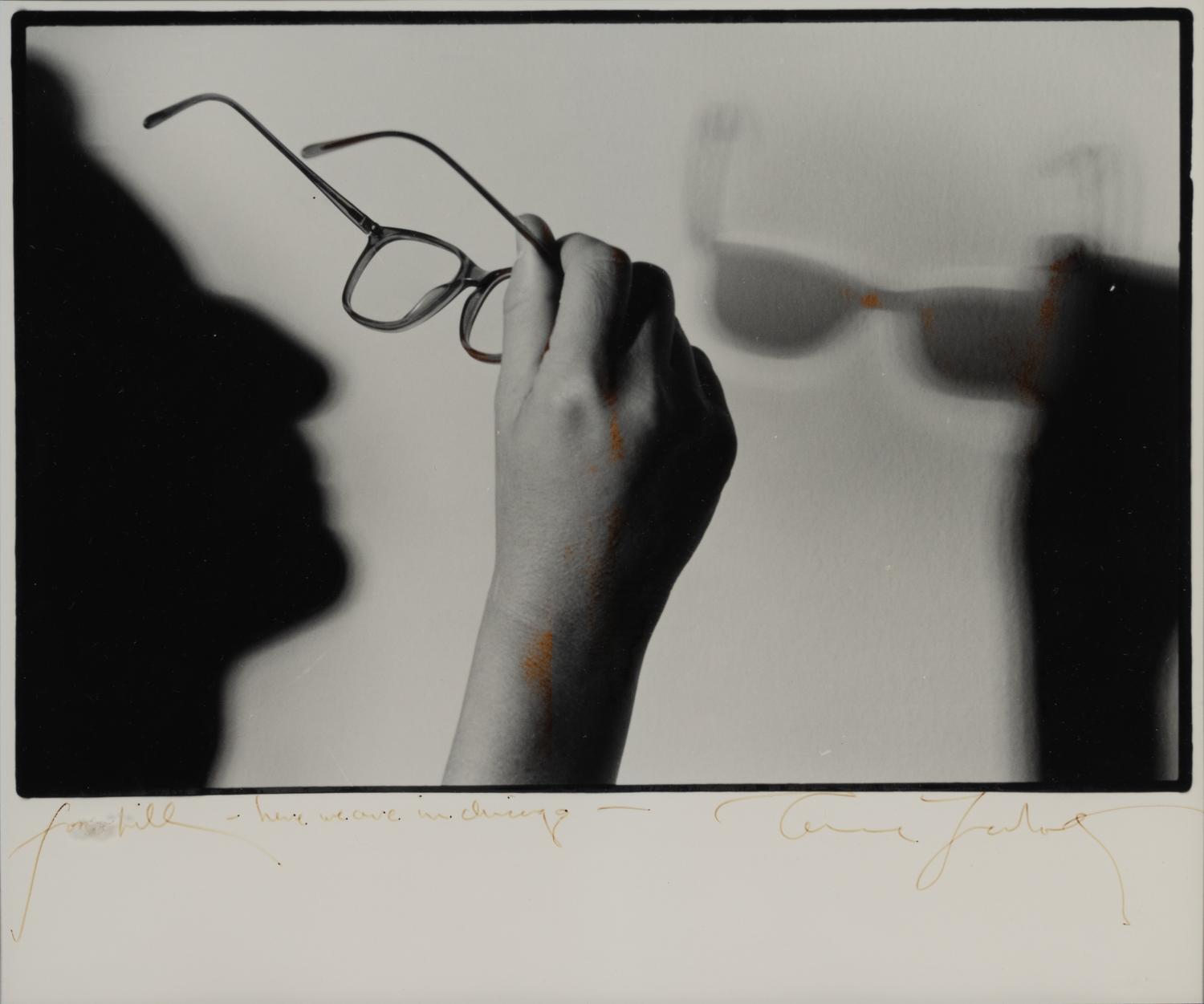 (Celebrity Ephemera) LEIBOWITZ, Annie (1949). Portrait of the artist’s glasses and shadow in profile.