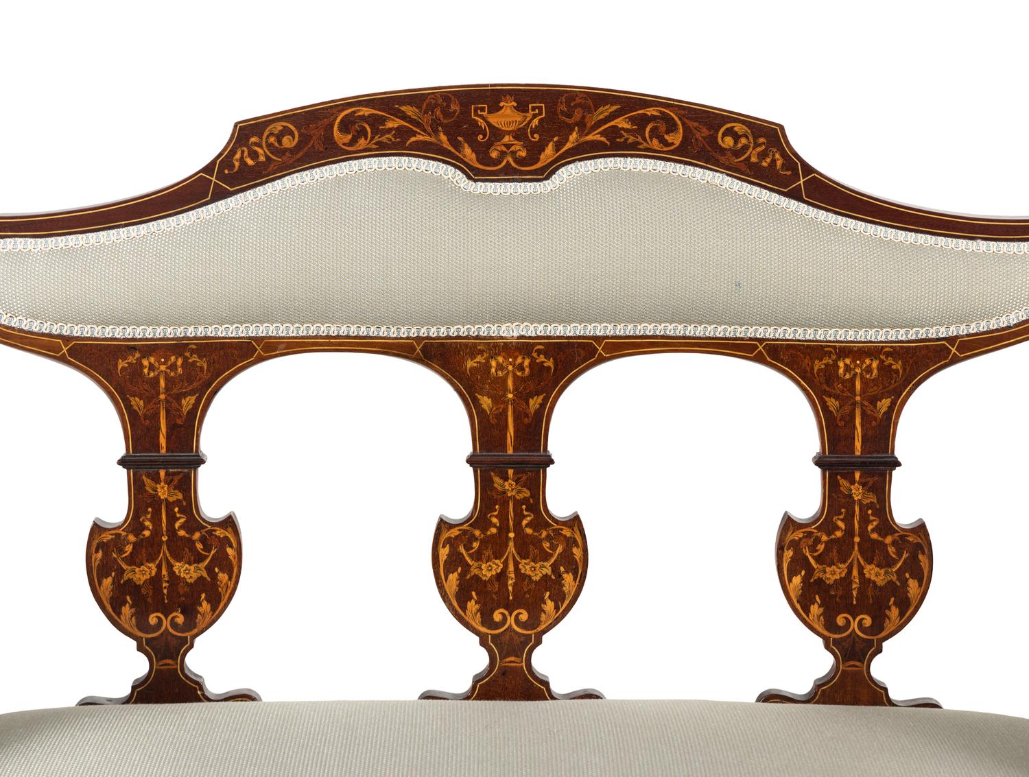 An Edwardian Mahogany and Marquetry Settee