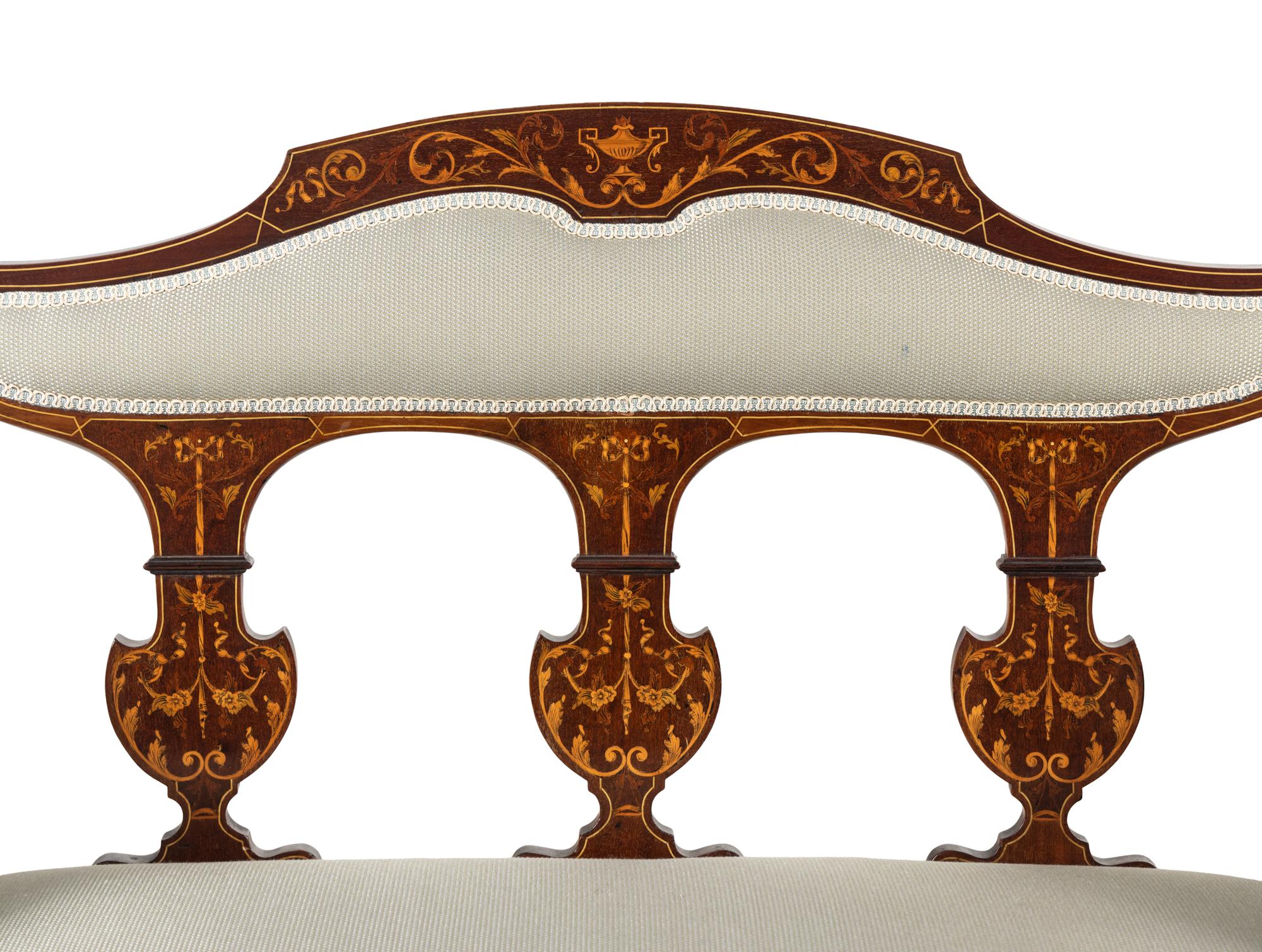 An Edwardian Mahogany and Marquetry Settee