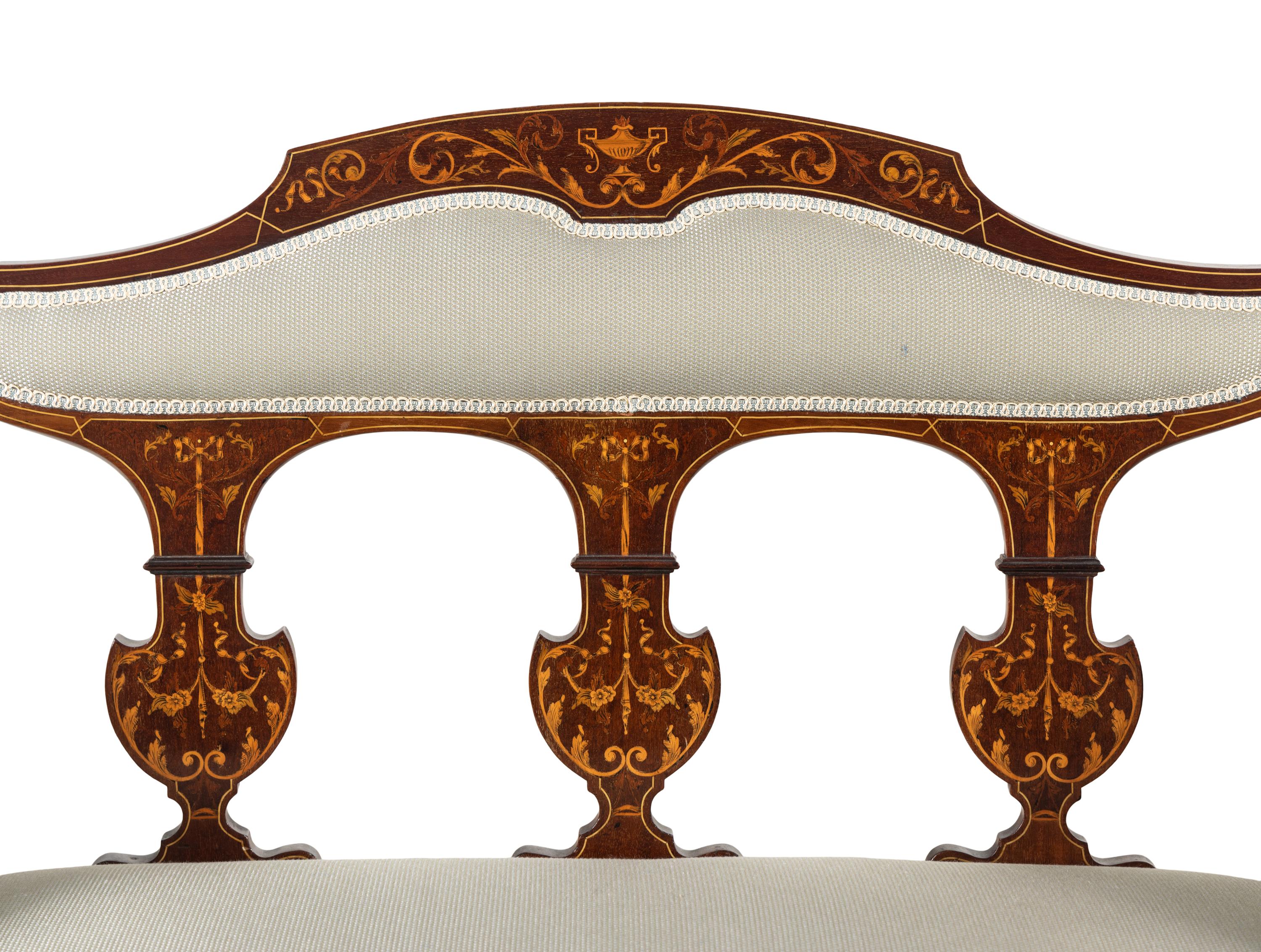 An Edwardian Mahogany and Marquetry Settee